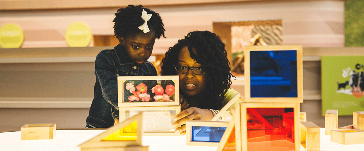Photo of a woman and her daughter playing in the Children's Gallery