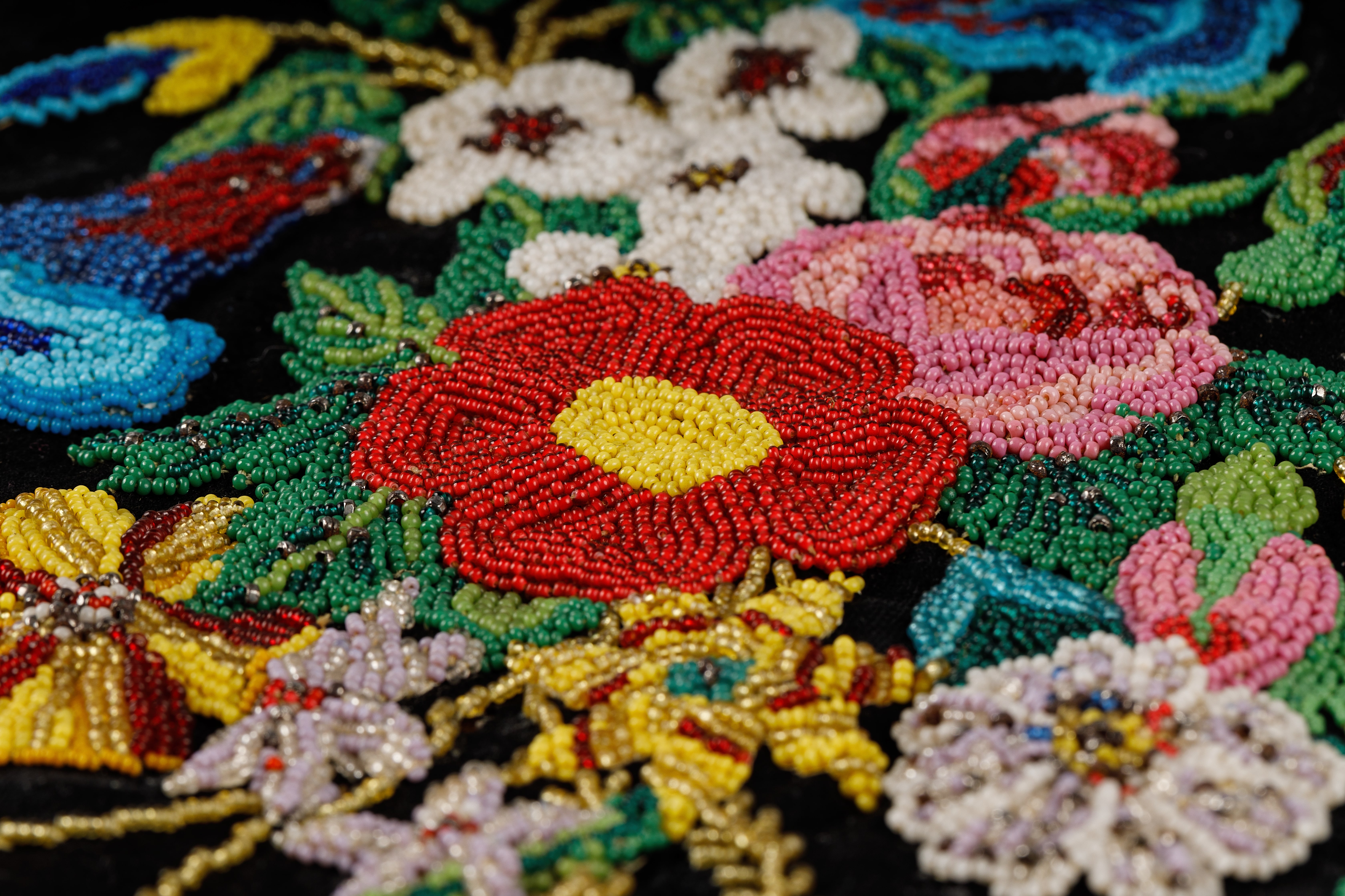 A close-up image of beaded flowers from a Métis octopus bag
