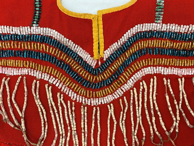 A closely cropped image of the beading details on a red dress