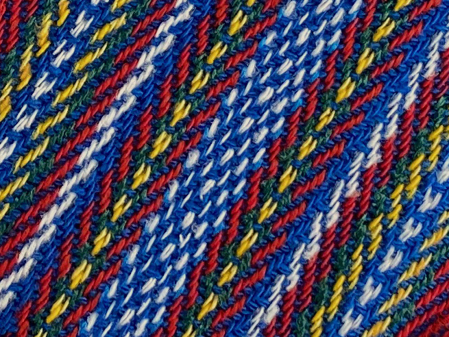 zoomed in image of a colourful Metis sash