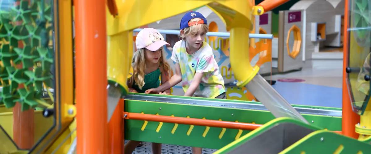 Two children play in the Children's Gallery