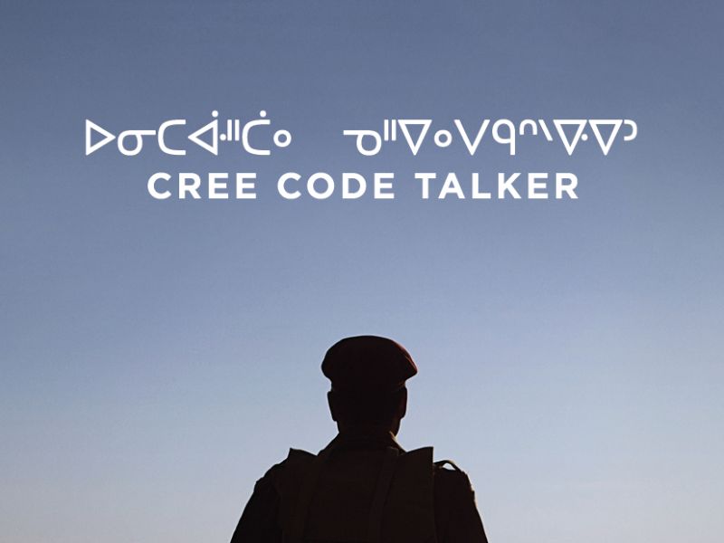 Cree Code Talker, with a backlit photo of a soldier