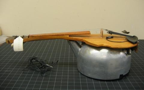 Electric fiddles made from a washboard and a tea kettle