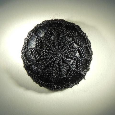 black needlework button