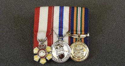 Miniature medals Fil wore on formal occasions: L-R: Order of Canada, Queen Elizabeth II Diamond Jubilee, Alberta Centennial medals
