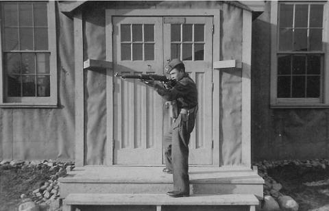 Archie Calliou, age sixteen, holding a rifle at a training base in Ontario, probably Petawawa. Photograph courtesy of Dorothy Calliou.