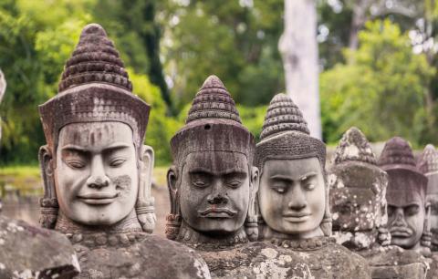 Giant stone statues of soldiers at Angkor, Cambodia.