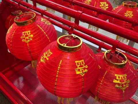 photo of red Chinese lanterns and gold writing