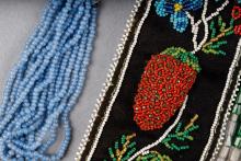A close-up image of beaded strawberries from a Métis octopus bag