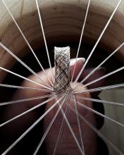 Close up photo of spools of hair being braided.