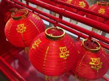 photo of red Chinese lanterns and gold writing